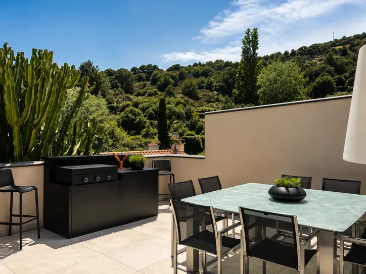 Outdoor dining terrace with Weber BBQ